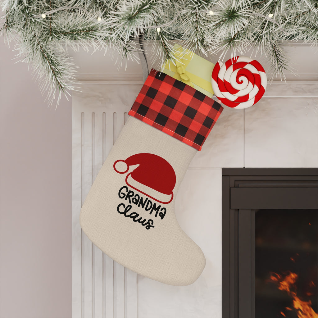 Grandma Claus Christmas stocking hanging by a fireplace
