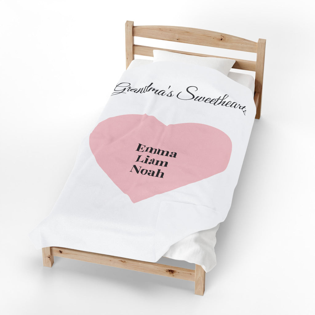 Grandma's Sweethearts personalized names blanket on a bed - additional view